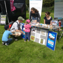 visitors learning about bogs with the moors for the future partnership at Edale Country Day