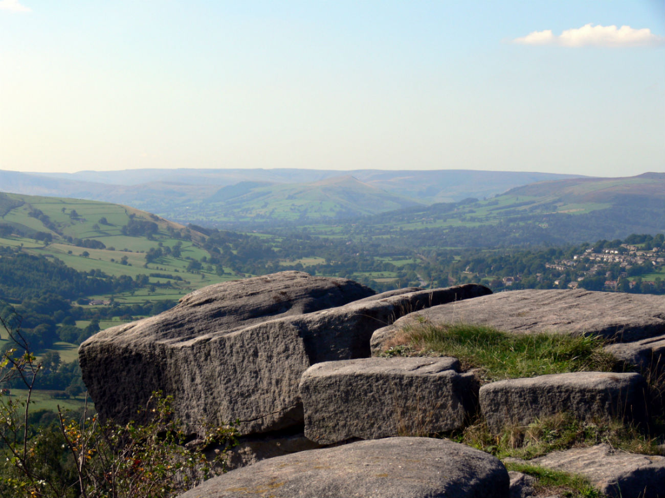 Rocks framing a view of rolling hills of the moorland