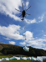 Image of a helicopter airlifting MoorLIFE 2020 projects