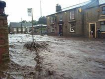 Image of high street west in Glossop flooded 