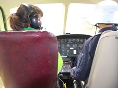 Leah Gooding from newsround in a helicopter 