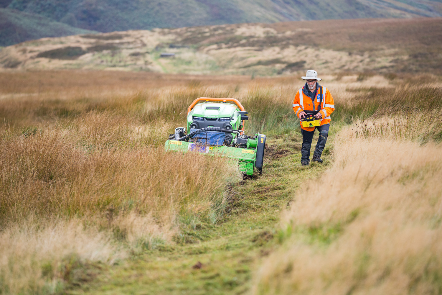 The remote controlled mower - the green climber- in action