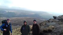 Three research and monitoring officers on top of the moors 