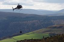 Image of helicopter flying with bag