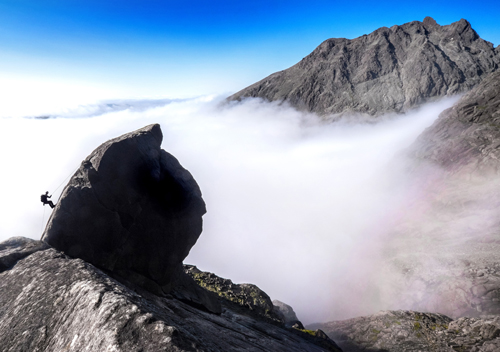 Image of a climber abseiling down the Cioch on Skye 