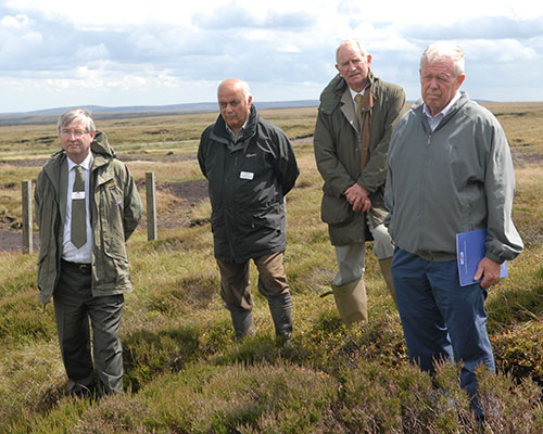 Jim Dixon Peak Chief Executive and Narendra Bajaria Chair  of Peak District National Park Authority, Mr J Howard, tenant farmer & Poul Christensen, Chair of Natural England.